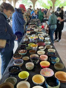 Sep-21-2024-05-DL Just one side of the "square" of tables as people search for that special bowl.